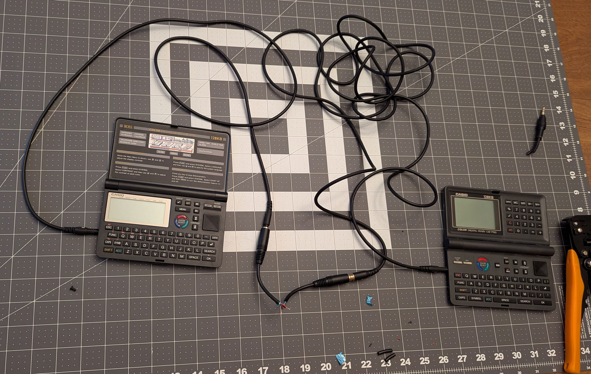 The CSF-7950 and CSF-4950W, connected by a janky cable