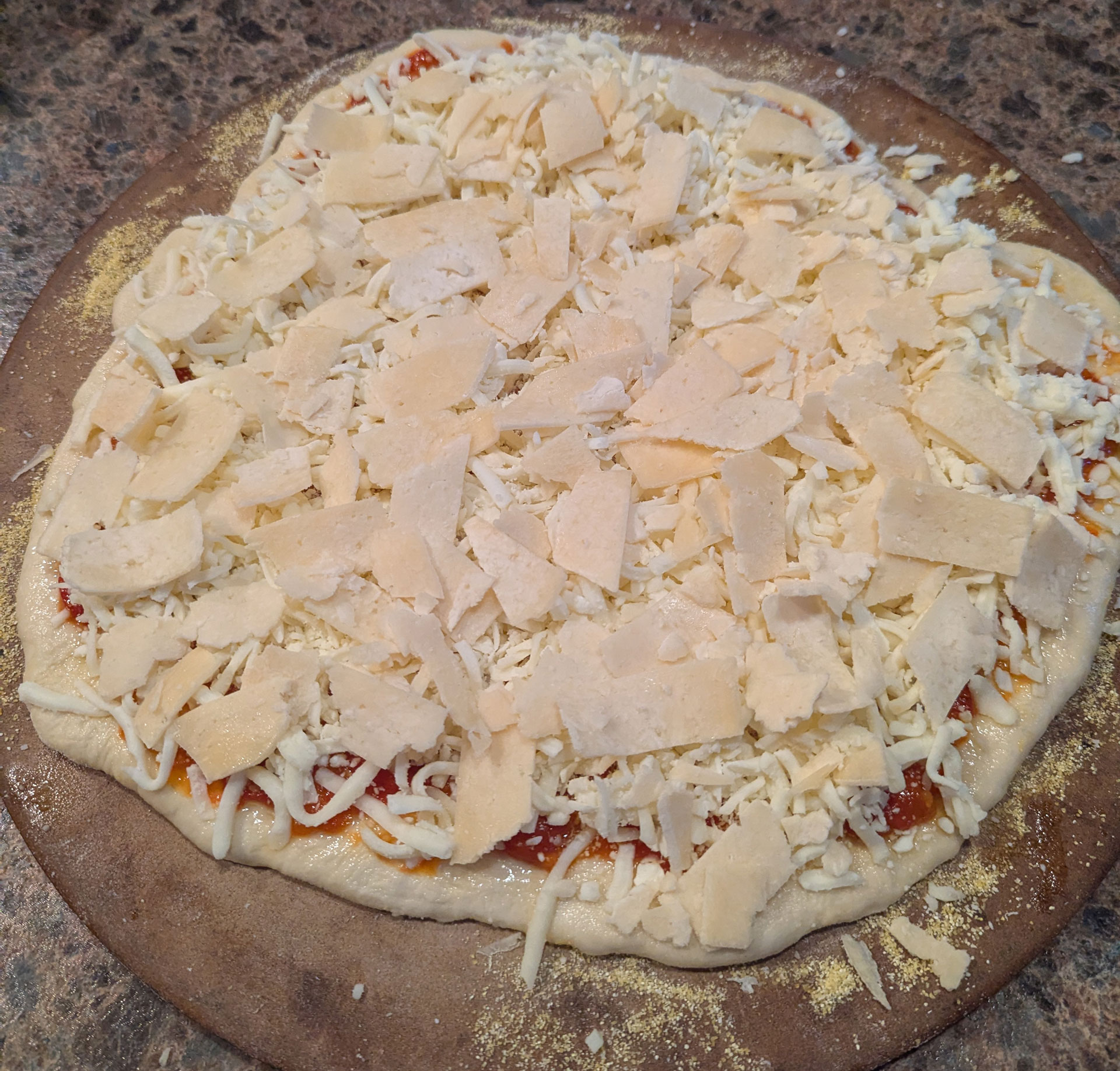 The raw pizza, fully assembled.