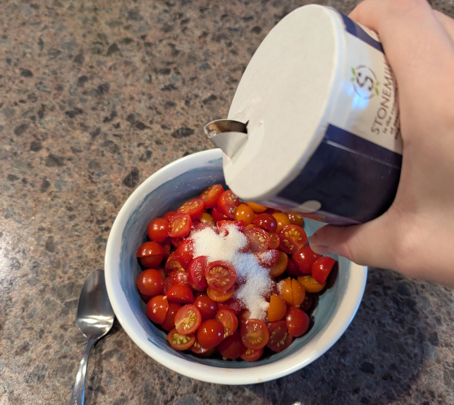 Pouring salt onto the tomatoes