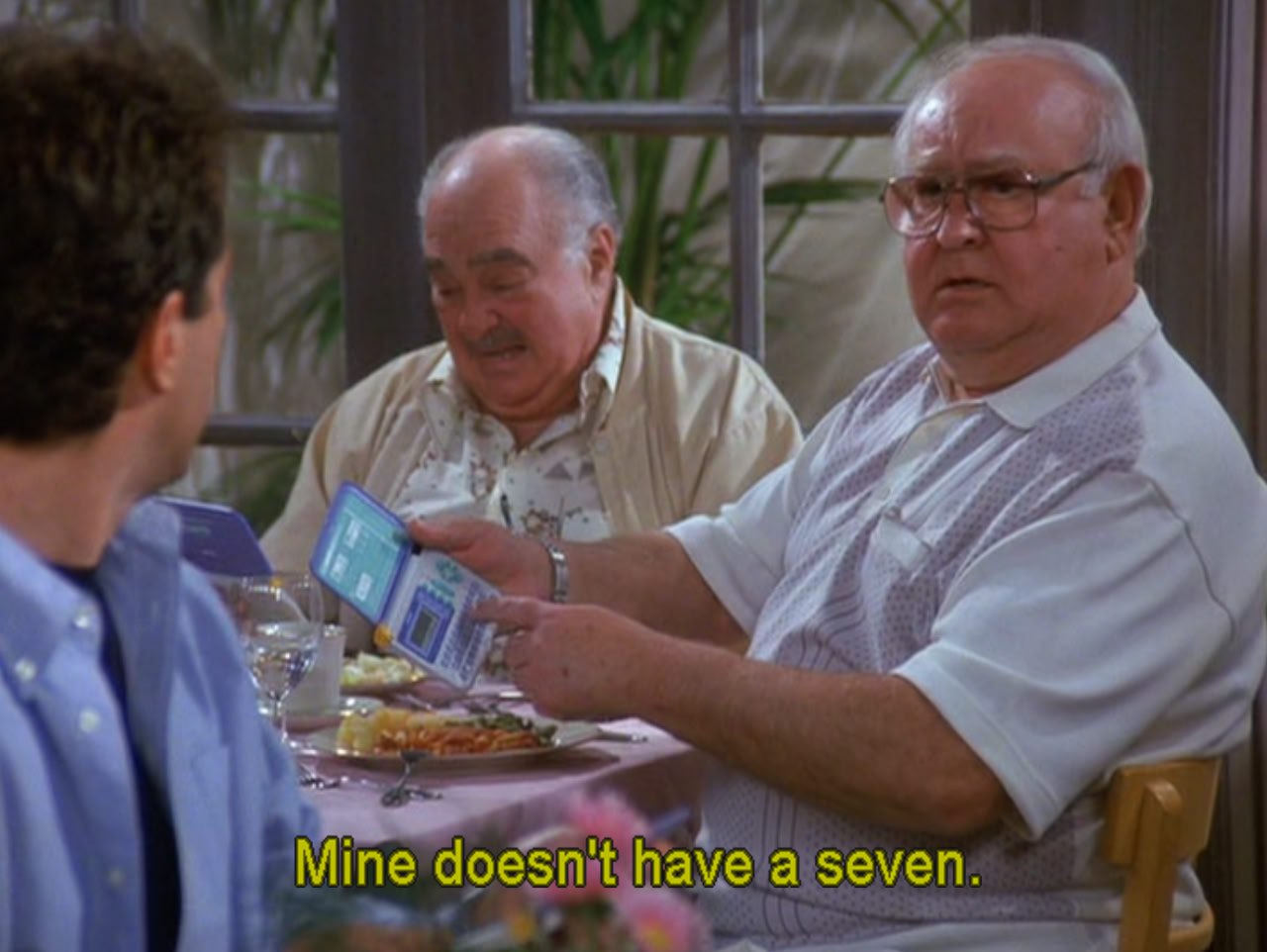 a Seinfeld extra holding a JD-6600 and proclaiming 'mine doesn't have a 7'